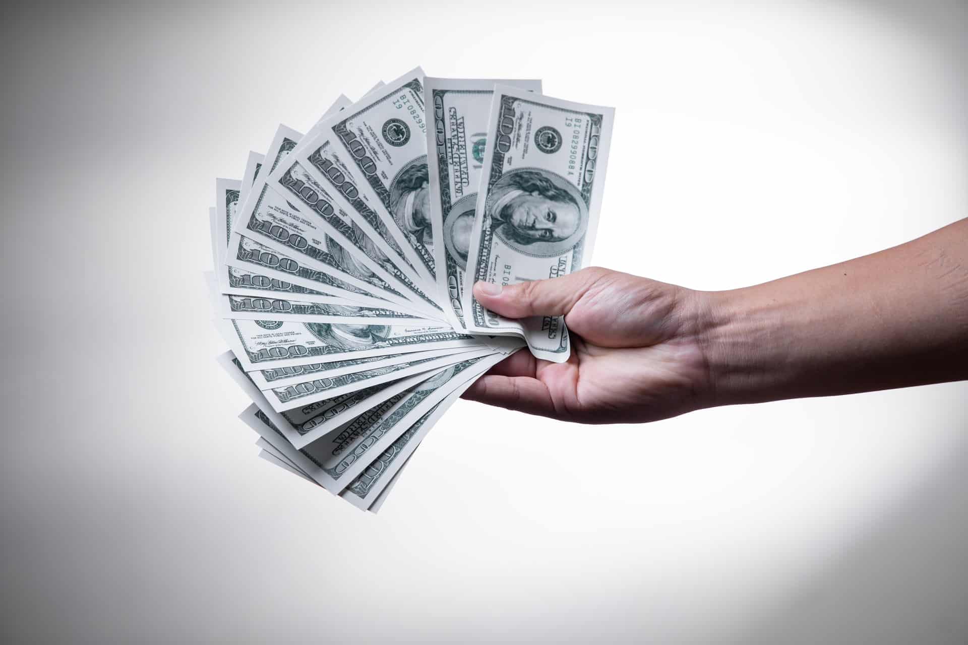 Person Holding Money Person Holding Money