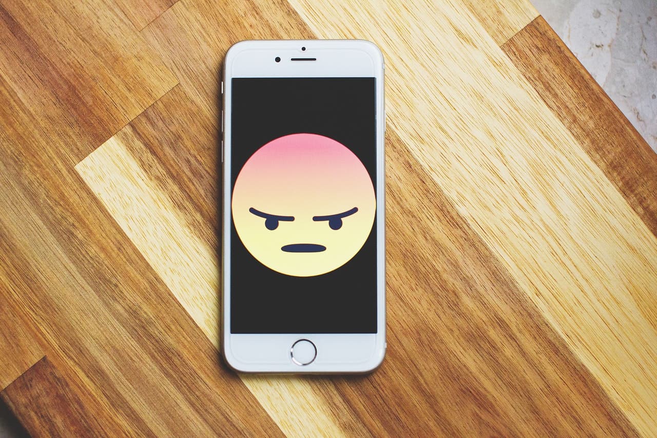 Mad Emoji on Cell Phone Mad Emoji on Cell Phone