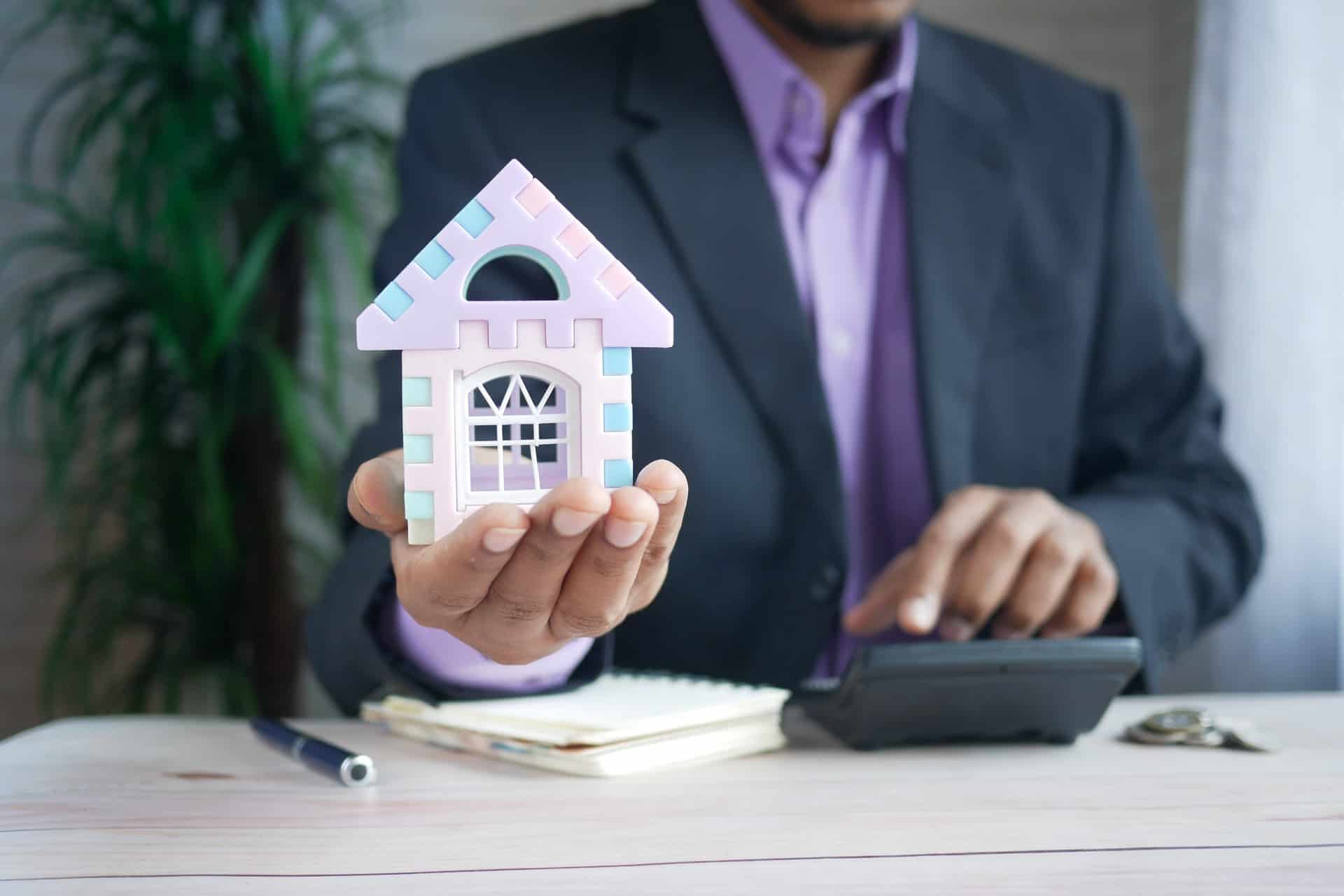 Man Holding Model House Calculator Pen Suit Man Holding Model House Calculator Pen Suit