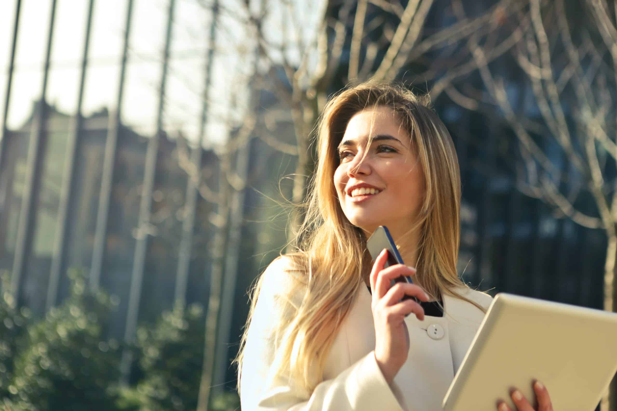 woman smile papers work woman smile papers work