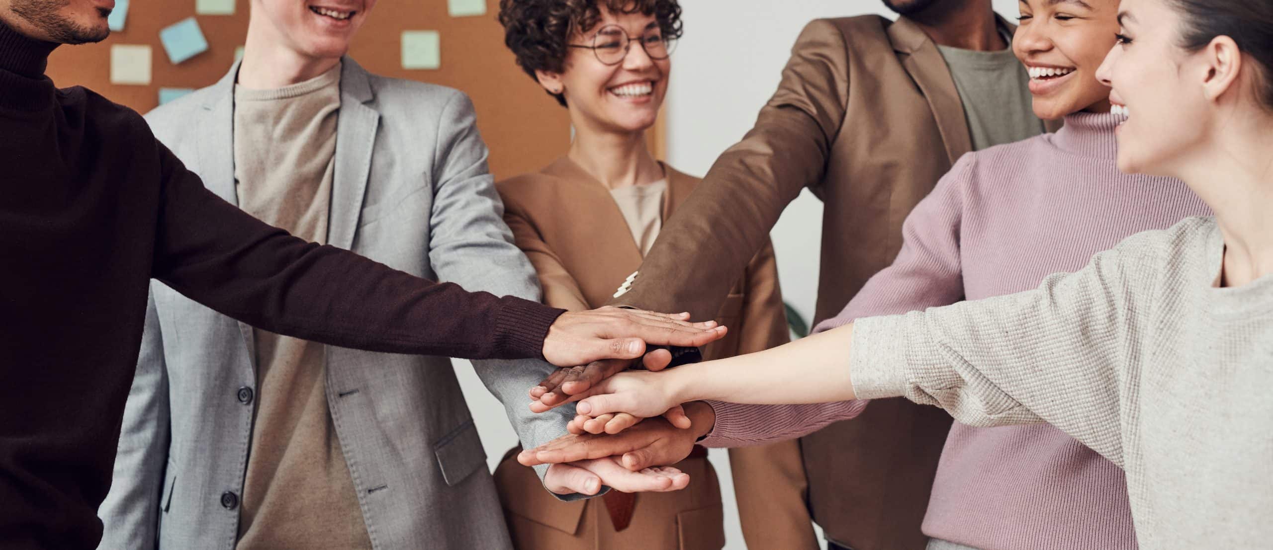 team hands in team hands in