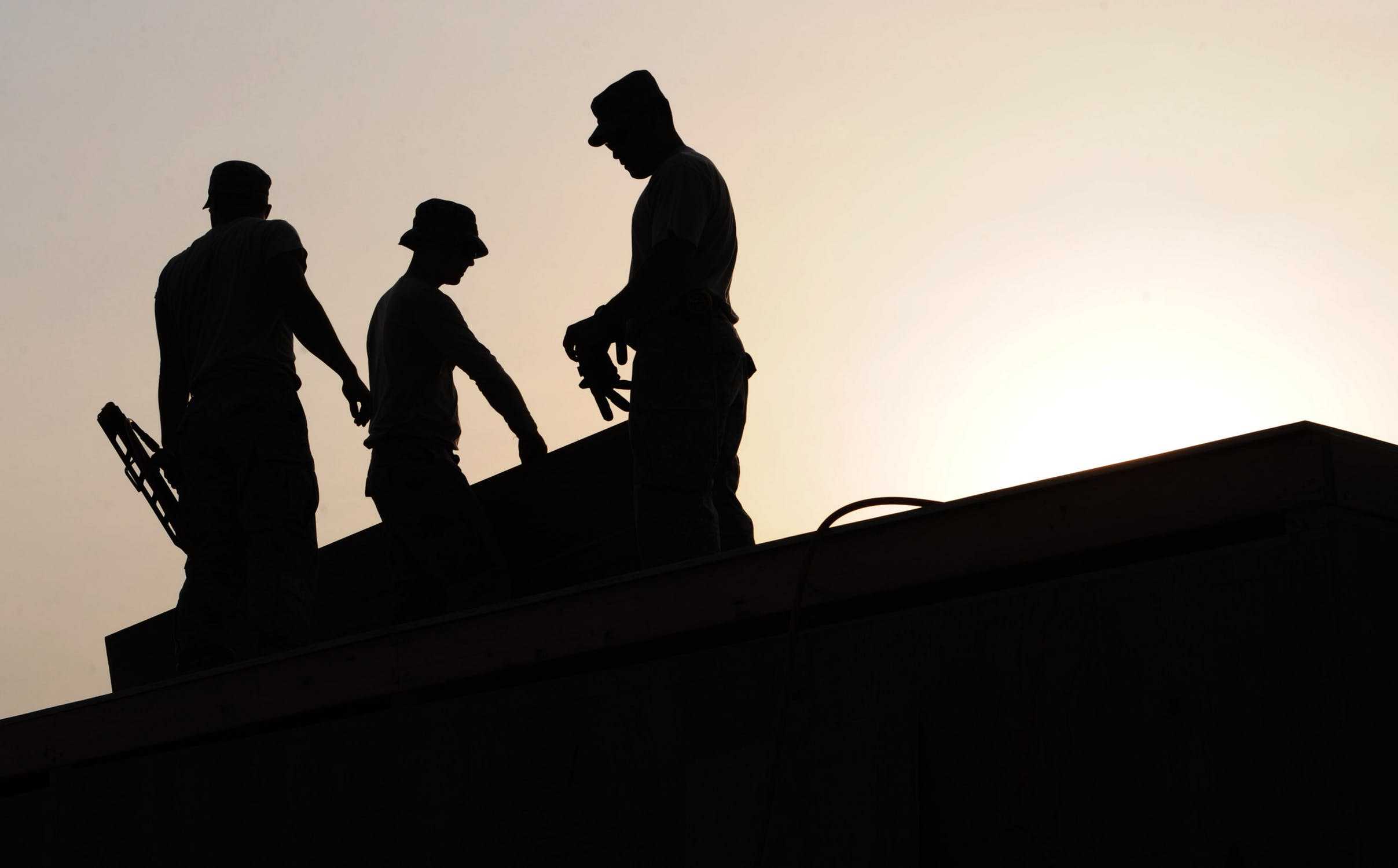 Construction workers roof