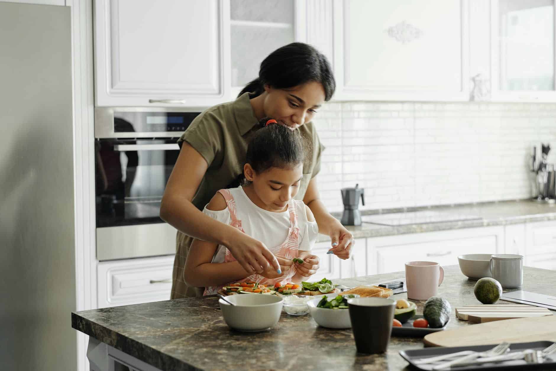 Mother daughter kitchen cooking