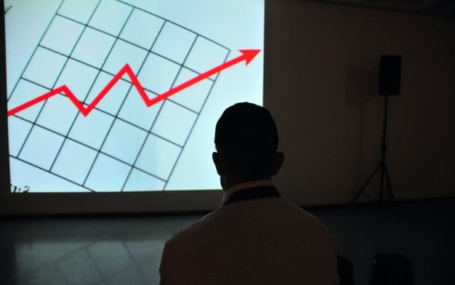 man watching rising chart man watching rising chart