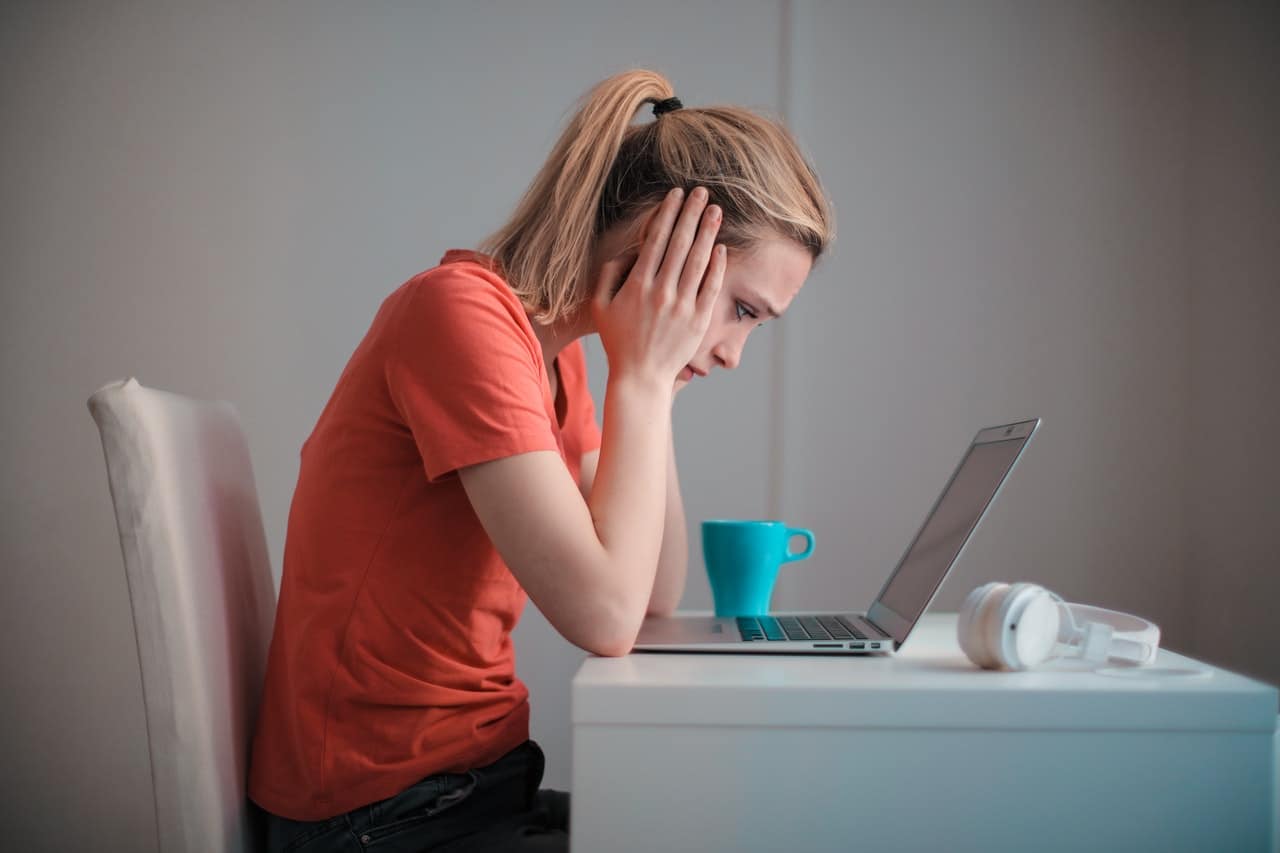 sad woman at computer