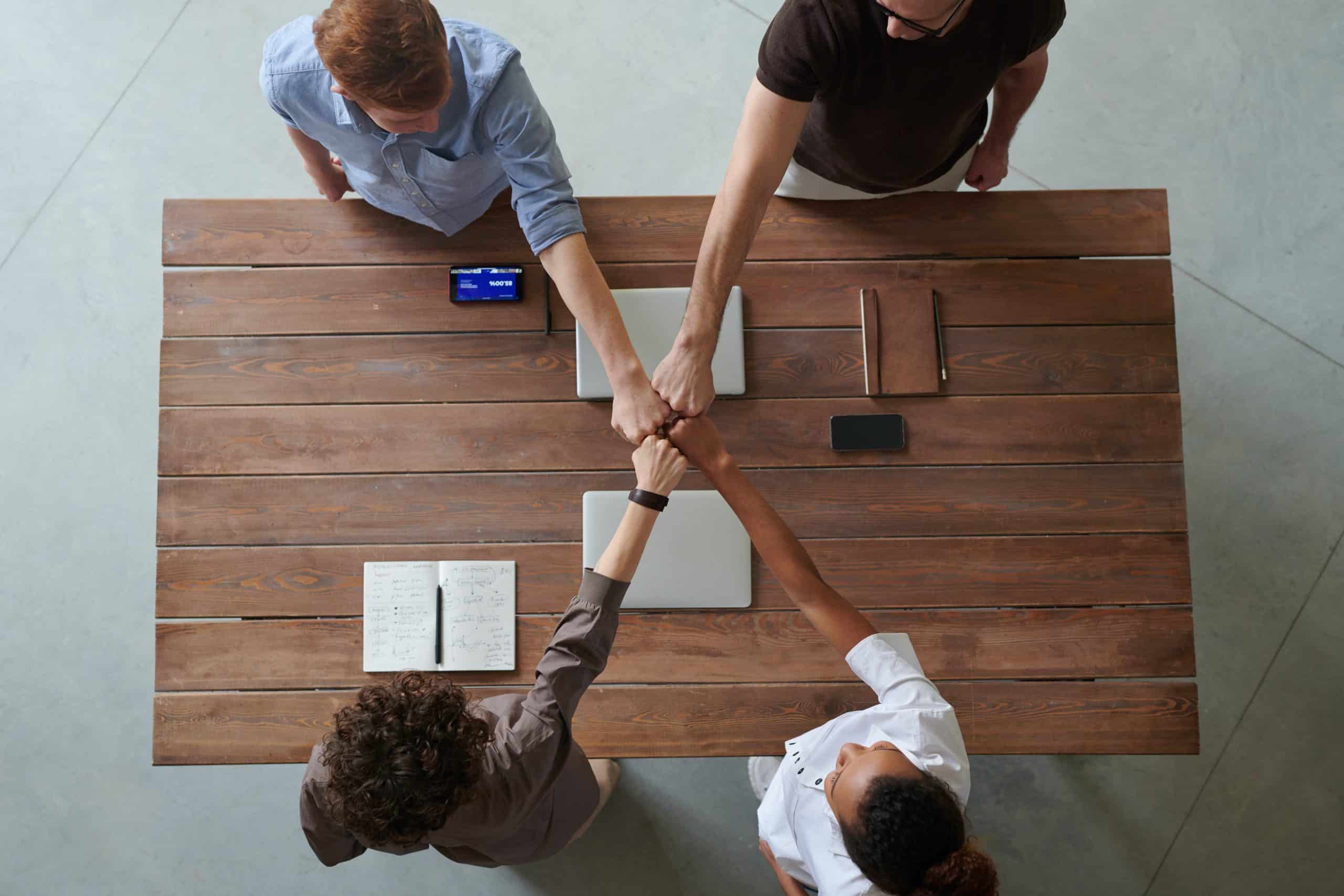 fist bump across table