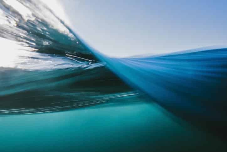 Vortex split view of blue ocean waters surface