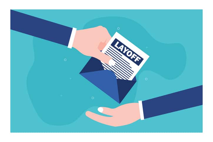 An employee picks a layoff letter from an envelope