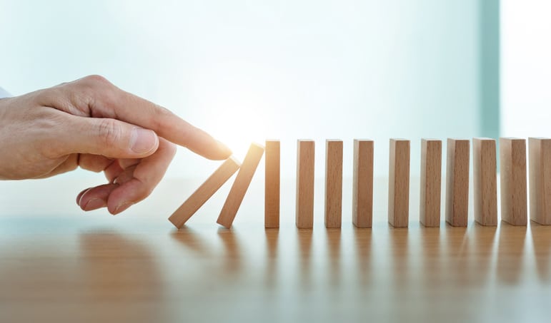 Man finger pushing domino pieces