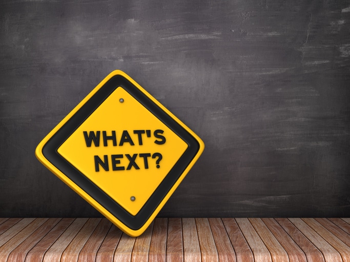 WHAT’S NEXT Road Sign on Chalkboard Background – 3D Rendering