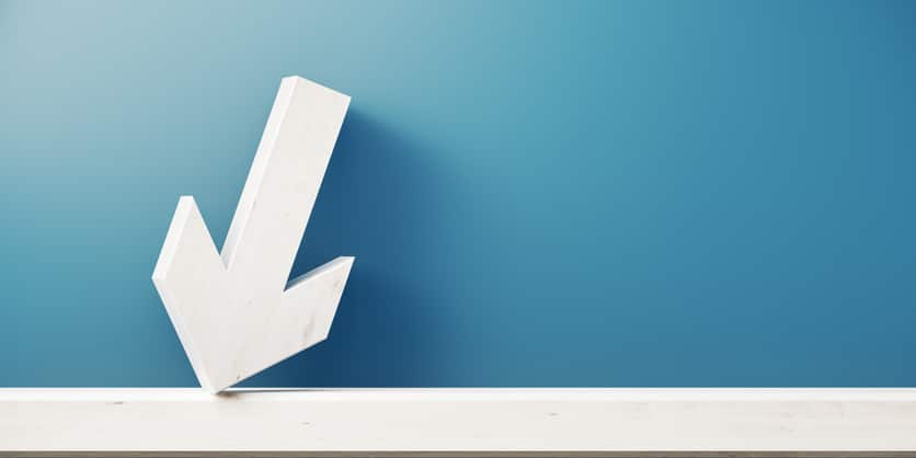 Arrow Symbol In Front Of Blue Wall – Loss And Recession Concept