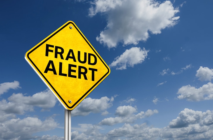Fraud Alert road warning sign