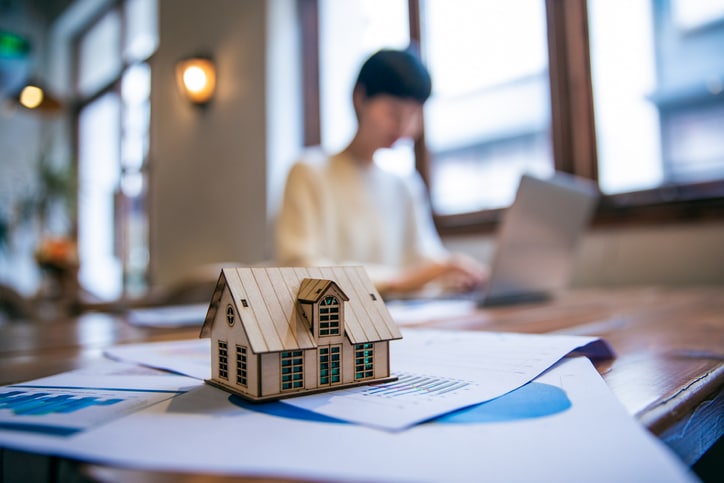Real Estate Agent Working On Laptop