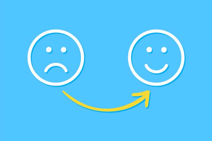 Drawing Unhappy and Happy Solution Concepts on Blue Background