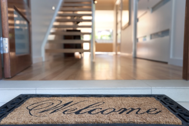 Close up of a welcome mat in an inviting house Letter from the Editor