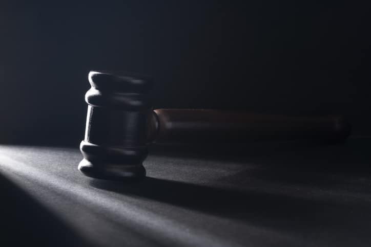 Gavel on the black table