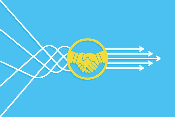 Solution Concept with Handshake on Blue Background Partnership Integration Business