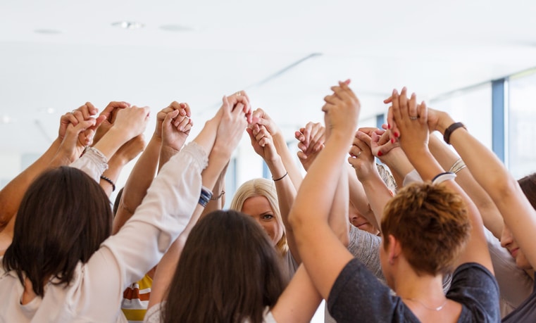 Group of women holding hands. Unity concept