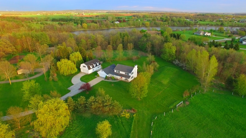 Evening aerial view of scenic rural home in Springtime Low Density Housing Acreage Country