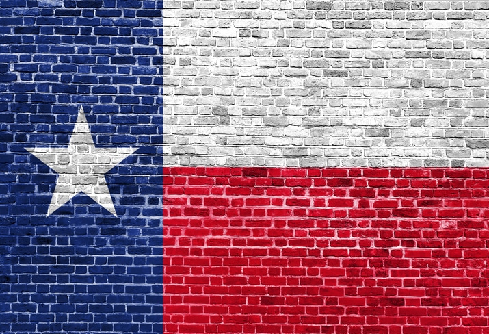 Texas US flag painted on old vintage brick wall Texas Strong Flag Real Estate