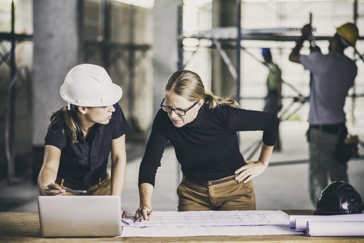 Female construction worker consulting an architect Woman, Women, Architect, Construction