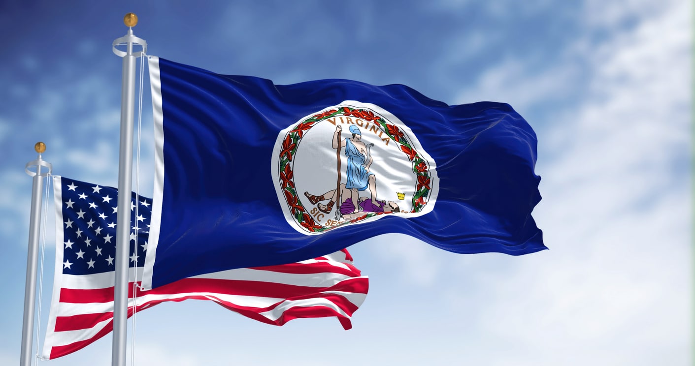 The Virginia state flag waving along with the national flag of the United States of America